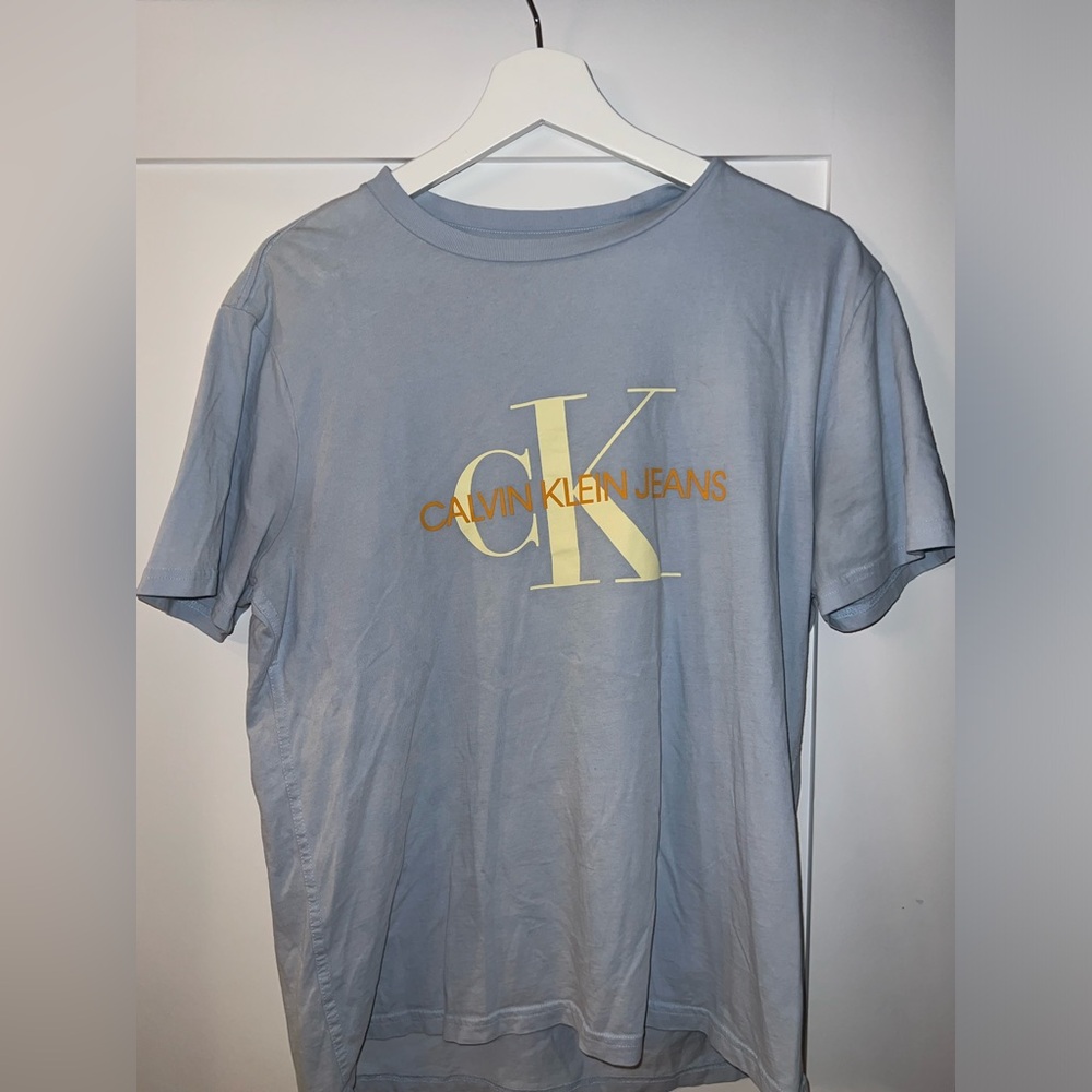Light blue Calvin Klein shirt, men’s medium, never worn.